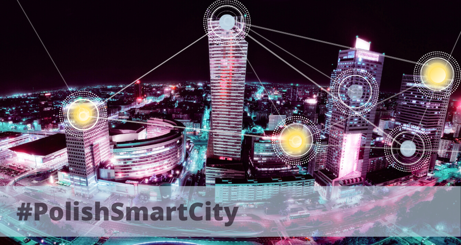 Na zdjęciu widoczne jest miasto mocą, oświetlone wieżowce połączone są abstrakcyjną laserową linią